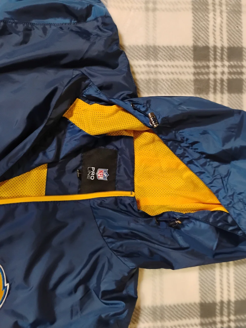 NFL Black Jacket with Red and Blue Shield Logo